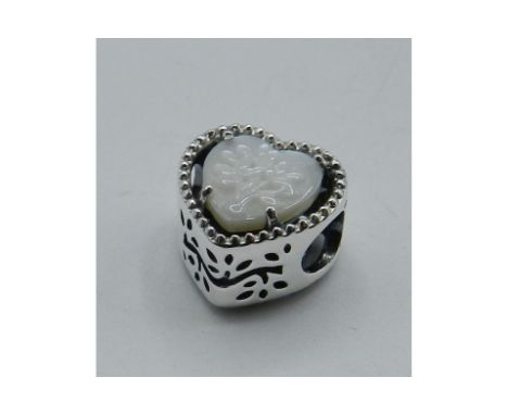 Pandora Heart & Family Tree openwork charm. An openwork design that includes a heart-shaped mother of pearl disc with a raise