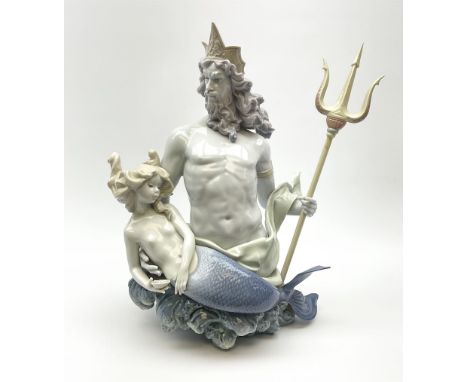 A large Lladro figure, In Neptunes Waves, modelled as Neptune with trident and mermaid, with printed mark beneath and impress