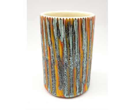 A Poole Pottery Delphis vase, shape 83, with textured effect in merging tones of red, yellow and blue, with printed mark bene