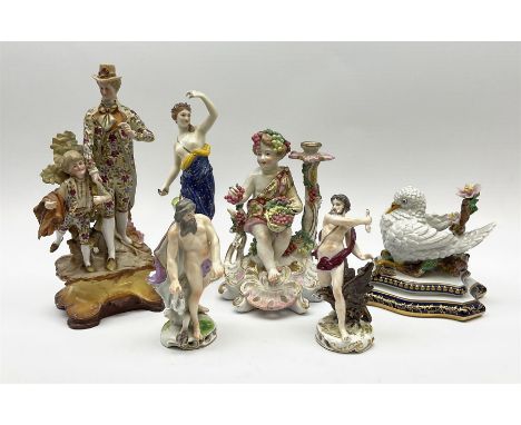 A group of assorted figures, to include a 19th century porcelain cherub candlestick modelled as Autumn, a Derby style figure 