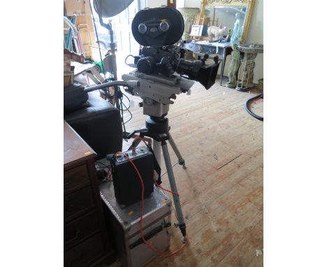 An Arriflex 16BL 16mm Movie Camera with fitted box and two film cannisters, mounted on Vinten Fluid Cam Head and Type 3061 tr