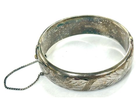 Vintage hallmarked silver bangle with safety chain, with leaf detailing overall weight 33.8g 