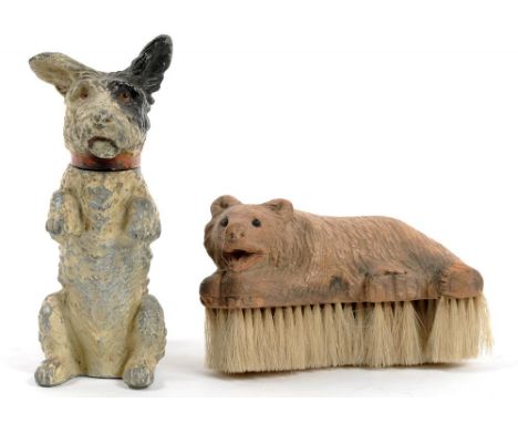 A COLD PAINTED SPELTER TABLE LIGHTER IN THE FORM OF A BEGGING TERRIER, 14CM H, C1930 AND A SWISS CARVED LIMEWOOD BEAR NOVELTY