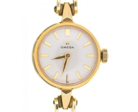 AN OMEGA GOLD PLATED LADY'S WRISTWATCH, ON GOLD STRAP MARKED 585, 1.8 CM DIAMETER, CASED++LIGHT WEAR CONSISTENT WITH AGE 