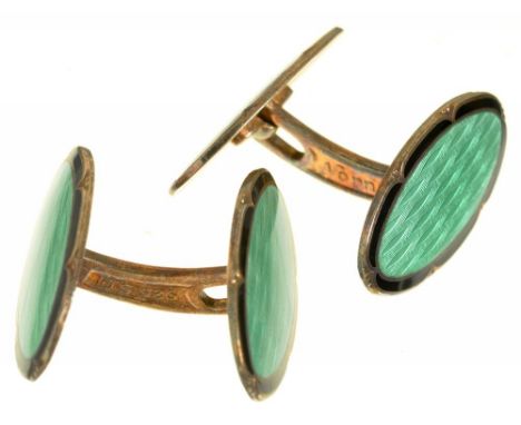 AKSEL HOLMSEN. A PAIR OF NORWEGIAN GREEN GUILLOCHE ENAMEL CUFFLINKS IN SILVER GILT, MARKED NORNE 925 S N++LIGHT WEAR CONSISTE