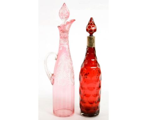 AN INTAGLIO ENGRAVED CRANBERRY FLASHED GLASS CLARET JUG AND STOPPER, 41CM H, EARLY 20TH C AND A FACETED RUBY GLASS DECANTER A