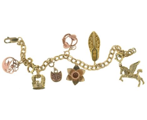 A 9CT GOLD BRACELET WITH SEVEN GOLD CHARMS, THREE OF 9CT GOLD, ANOTHER MARKED 375 AND THREE UNMARKED, 16G++LIGHT WEAR CONSIST
