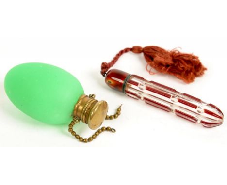 A VICTORIAN EGG SHAPED FROSTED GREEN OPAL GLASS SCENT BOTTLE, WITH BRASS CAP, 6.5CM H AND A RUBY FLASHED AND CUT GLASS SCENT 