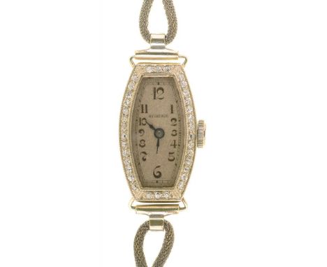 A BUCHERER DIAMOND TONNEAU COCKTAIL WATCH, C1930, IN WHITE GOLD MARKED 14C, ON PLATED BRACELET++LIGHT WEAR CONSISTENT WITH AG