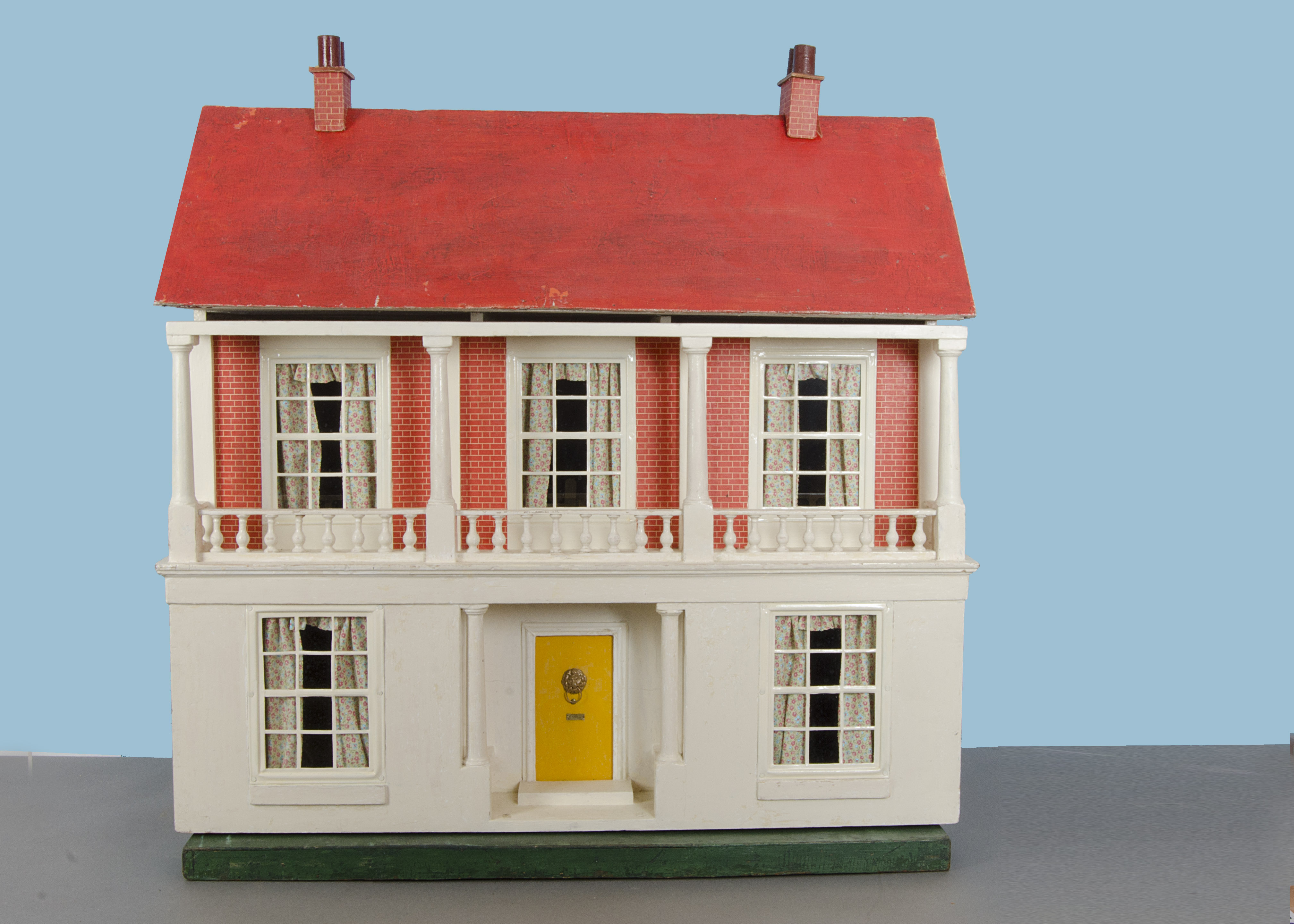 A large Tri-ang dolls’ house DH/3 1924, with cream painted façade ...