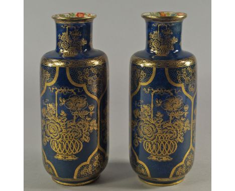 A pair of Booths  pottery vases, 20th century, printed with panels of gilt flower arrangements upon blue scale ground, the in