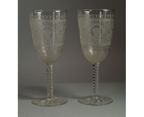 A pair of drinking glasses, late 19th century, acid etched and cut with reserves of portrait heads and sprays of flowers betw
