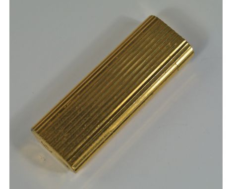 A Cartier gold plated lighter, with Playboy bunny motif engraved on hinged cover.