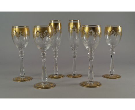 A Baccarat glass suite for six people, to include wine glasses, twelve champagne flutes, tall drinking and water glasses, the