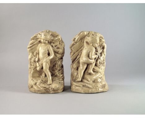 A pair of Bretby Pottery bookends, 20th century, modelled as children playing on naturalistic base, impressed Bretby mark and