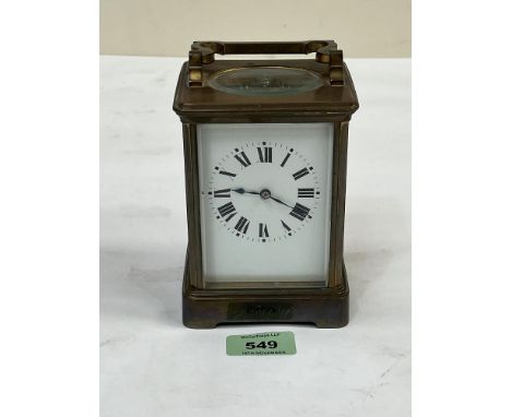 A French brass carriage clock, the movement with platform lever escapement, striking on the hour and half hour on a coiled go