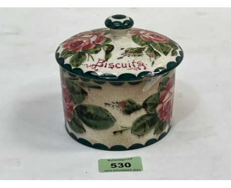 A Wemyss biscuit jar and cover, retailed by T. Goode, London. 4¼" high.