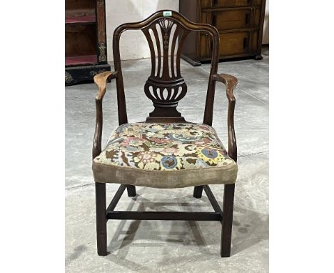 A George III Hepplewhite style mahogany armchair with broad tapestry upholstered over stuffed seat, on moulded chamfered fore