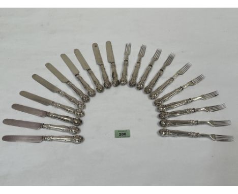 A set of cake knives and forks with loaded silver hafts.