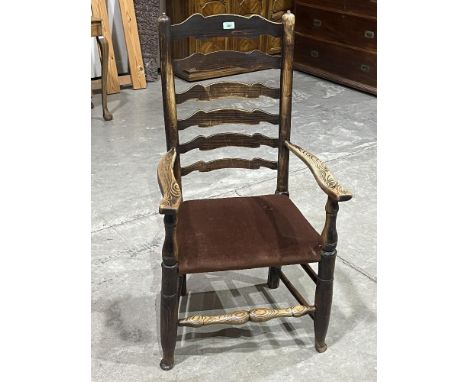 A 19th century ladder back armchair.