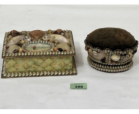 An early 20th century shellwork trinket box, 7" wide and a pin cushion.