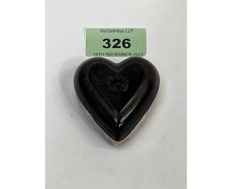 A tortoiseshell and silver mounted heart shaped box. Engraved initials and date 1926. 2" long.