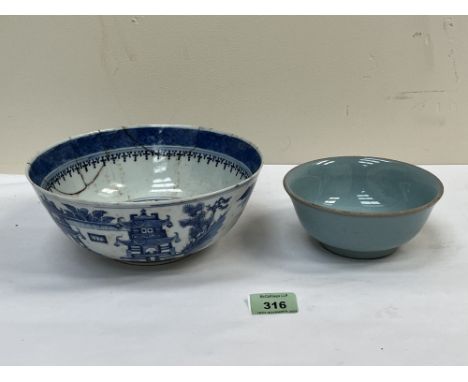 A Chinese blue and white bowl with extensive repairs, 8" diam and a smaller light blue glazed Chinese bowl.