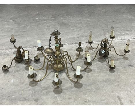 A brass eight light electrolier and two smaller examples.