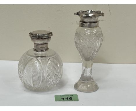 A cut glass silver topped scent bottle, 3¾" high and a silver mounted cut glass vase.