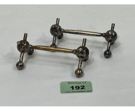 A pair of Edward V11 silver knife rests by Walker and Hall. Sheffield 1907. 4ozs 3dwts.