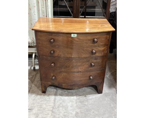 A 19th century mahogany commode in the form of a bow fronted chest. 26" wide.