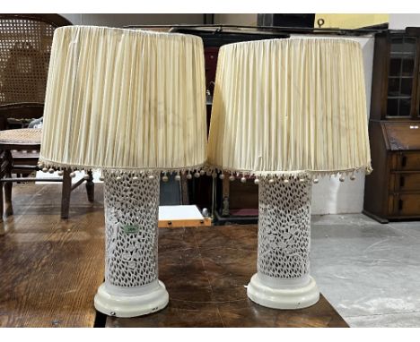 A pair of chinoiserie style reticulated ceramic table lamps. 15½" high excluding fitting.