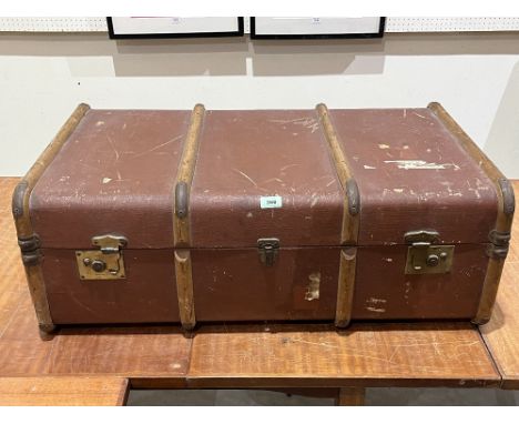 A vintage canvas and wood braced suitcase. 35" wide.