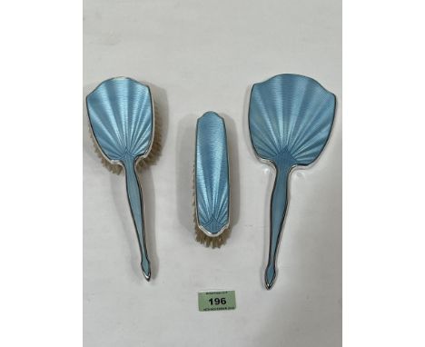 A George VI silver and blue guilloche enamel three piece dressing table set. Birmingham 1949. Slight loss to enamel.