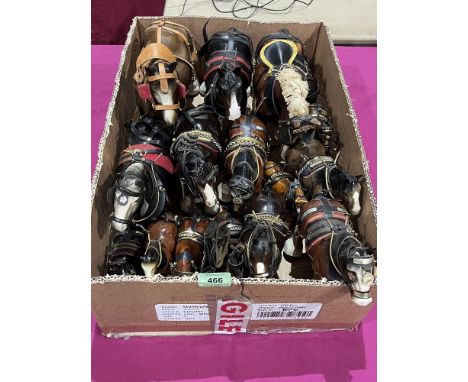 A collection of ceramic shire horses.
