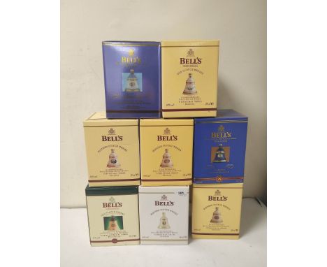 Eight Wade Bell's Whisky decanters and contents to include six Christmas decanters from 1998, 2003, 2005, 2006, 2007 and 2010