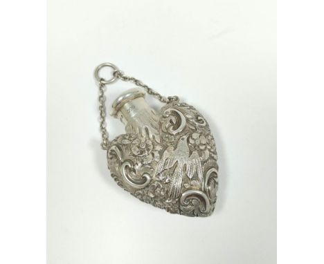 S. Mordan, silver perfume flask of heart shape, embossed with flowers and birds, 1890, 59mm x 44mm.&nbsp; 