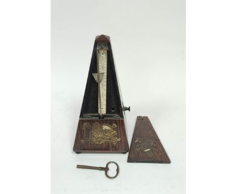 Early Pacquet metronome, no. 2310, in rosewood pyramidal case, with inlaid brass and pearl musical trophies, c1845, 23cm. 