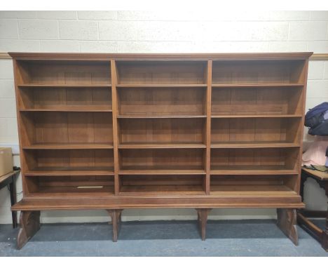 Oak open library bookcase, c.1870's, in the manner of Philip Webb, the moulded pediment above three tiers of adjustable shelv