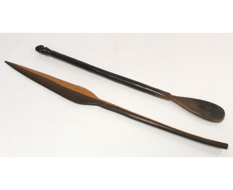 African tribal dance stick of short spear form in two tone hardwood, 75cm long and another stick or wand with mask head finia