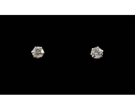 A pair of 18ct yellow gold diamond set stud earrings, (approx. 0.20ct).