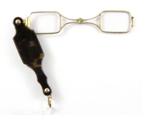 An Edwardian folding tortoishell cased lorgnette.