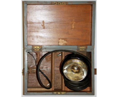 A boxed naval signalling lamp.