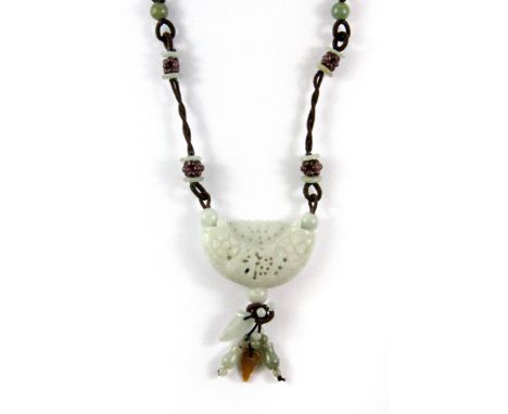 A lovely Chinese carved jade and silk cord necklace.