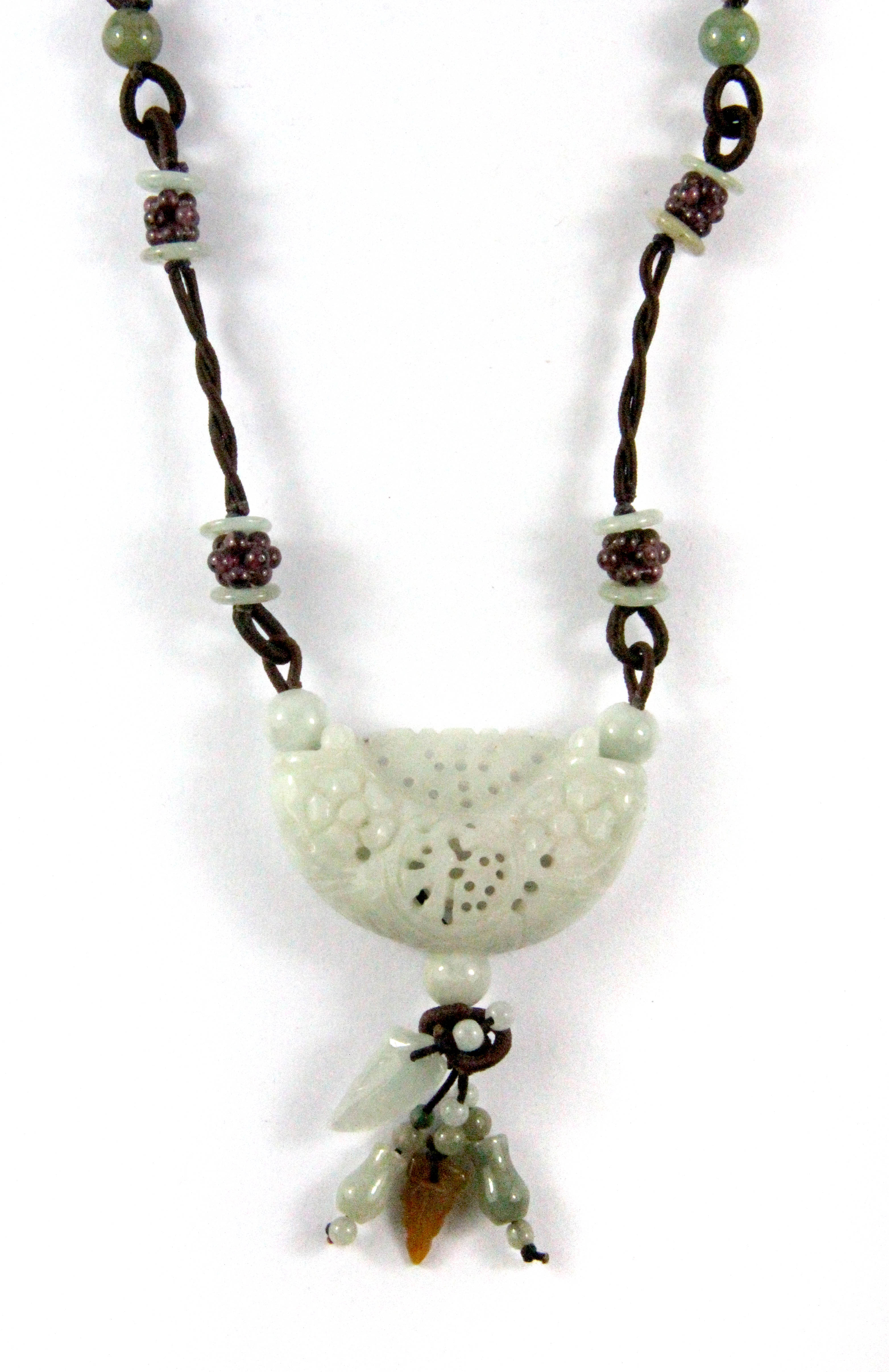 A lovely Chinese carved jade and silk cord necklace.