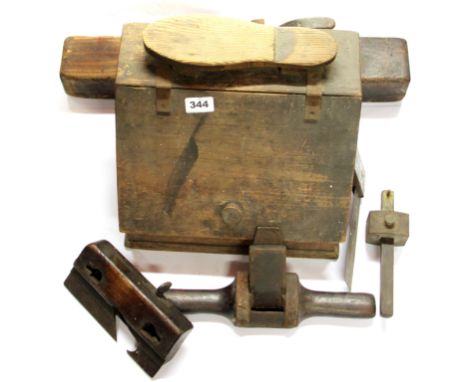 A vintage shoe shine box, together with a small group of wood working tools.