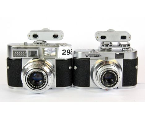 Two Voigtlander twin lens reflex cameras.