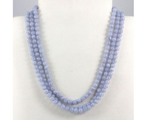 An old Chinese three row blue/lavender jade bead necklace with a white metal clasp, L. 45cm.