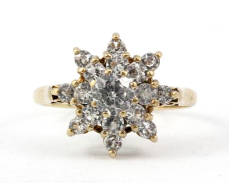 A yellow metal (tested 9ct gold) white topaz set cluster ring, (N).