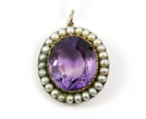 An Edwardian yellow metal (tested 9ct gold) amethyst and seed pearl set pendant, 2.6 x 2cm.